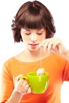 young-woman-making-a-cup-of-green-tea